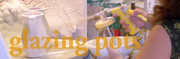 Glazing Pots: Darlene Yarnetsky sprays glaze on a pitcher